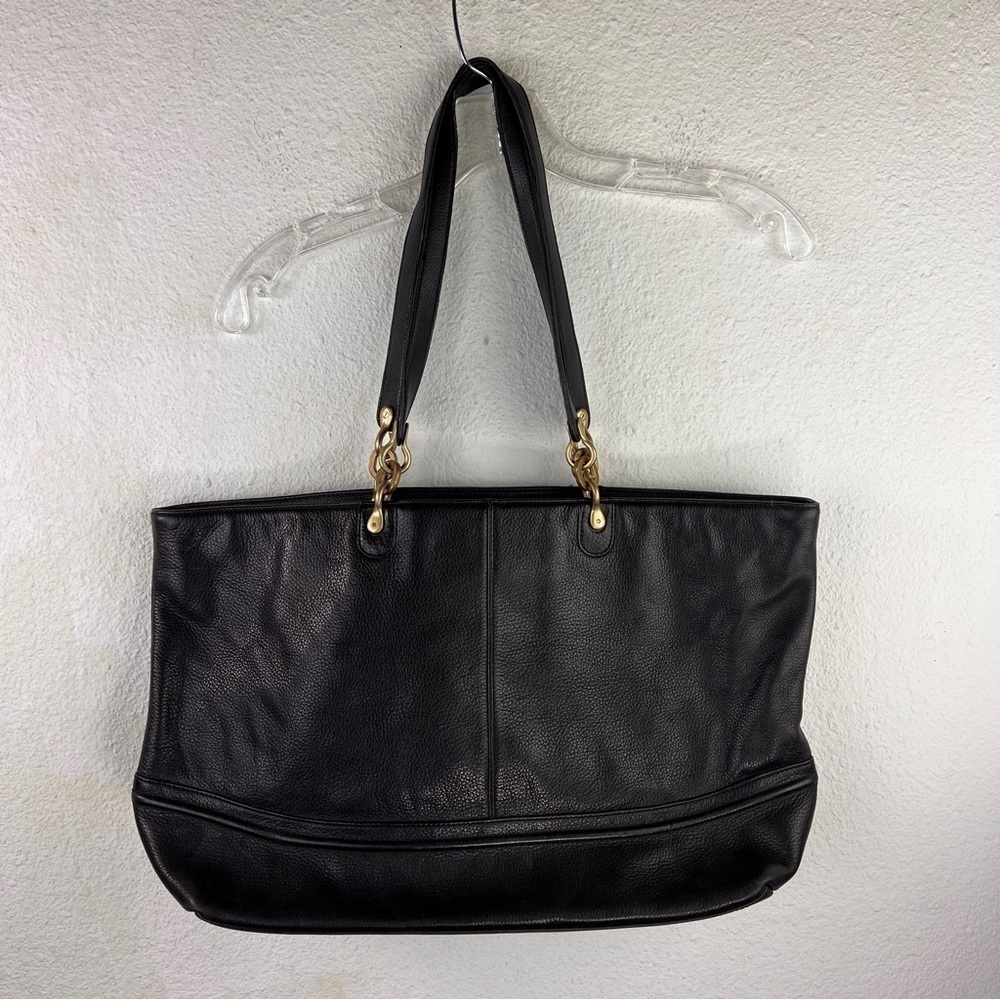 SUSAN GAIL SHOULDER SHOPPER. Black pebbled leather w/snap close. Shoulder straps